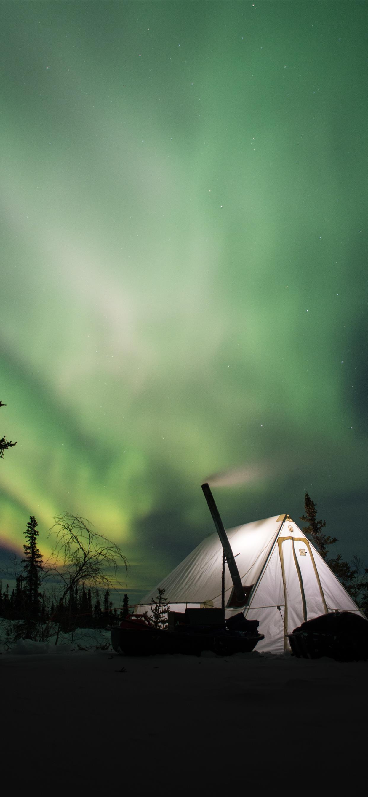 white camping tent and green Arora sky