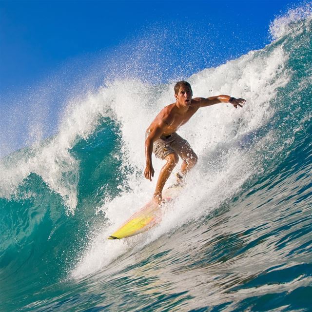 Surfer Riding A Wave iPad wallpaper 