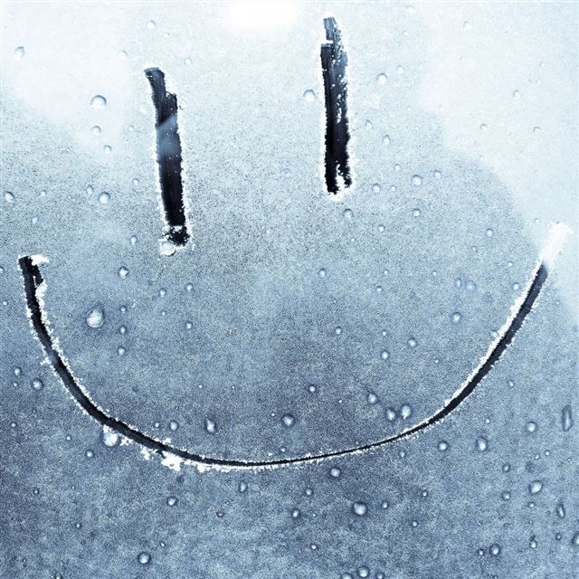 Smiley Face On A Frozen Window iPad wallpaper 