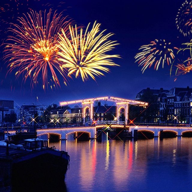 Colorful Firework Over City Bridge iPad wallpaper 