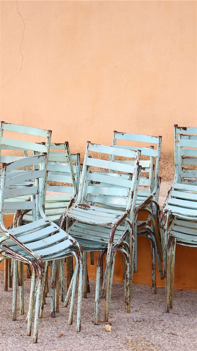 Stacked chairs in Greece iPhone 8 wallpaper 
