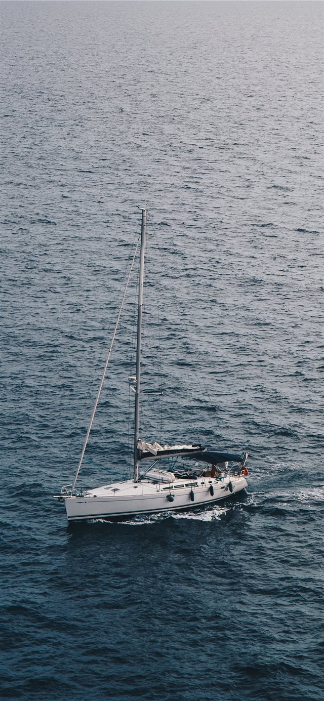 The lonely boat in the wide world iPhone X wallpaper 