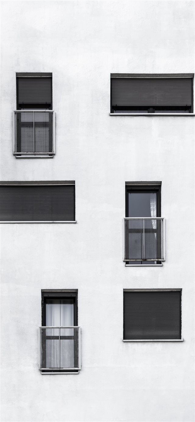 Black and white side of a building iPhone X wallpaper 