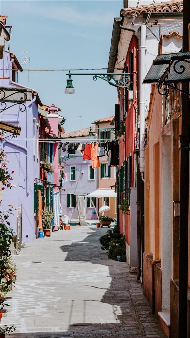 Laundry drying in alley  colourful Burano iPhone 8 wallpaper 