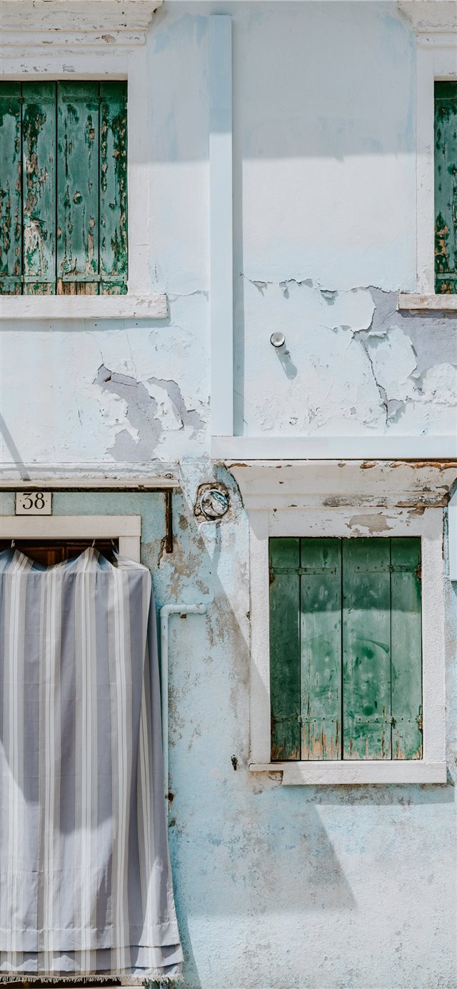 Pastel blue house with shutters iPhone X wallpaper 