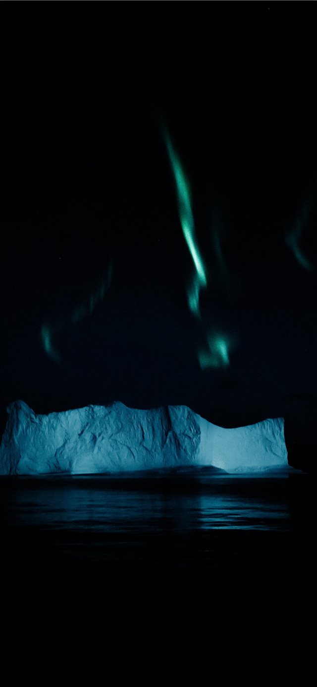 Northern lights above an iceberg in the Arctic iPhone X wallpaper 