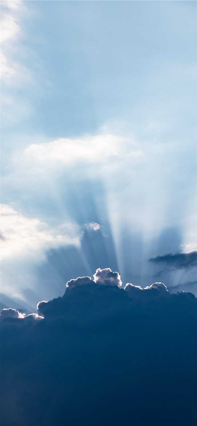 Sun behind the clouds iPhone X wallpaper 