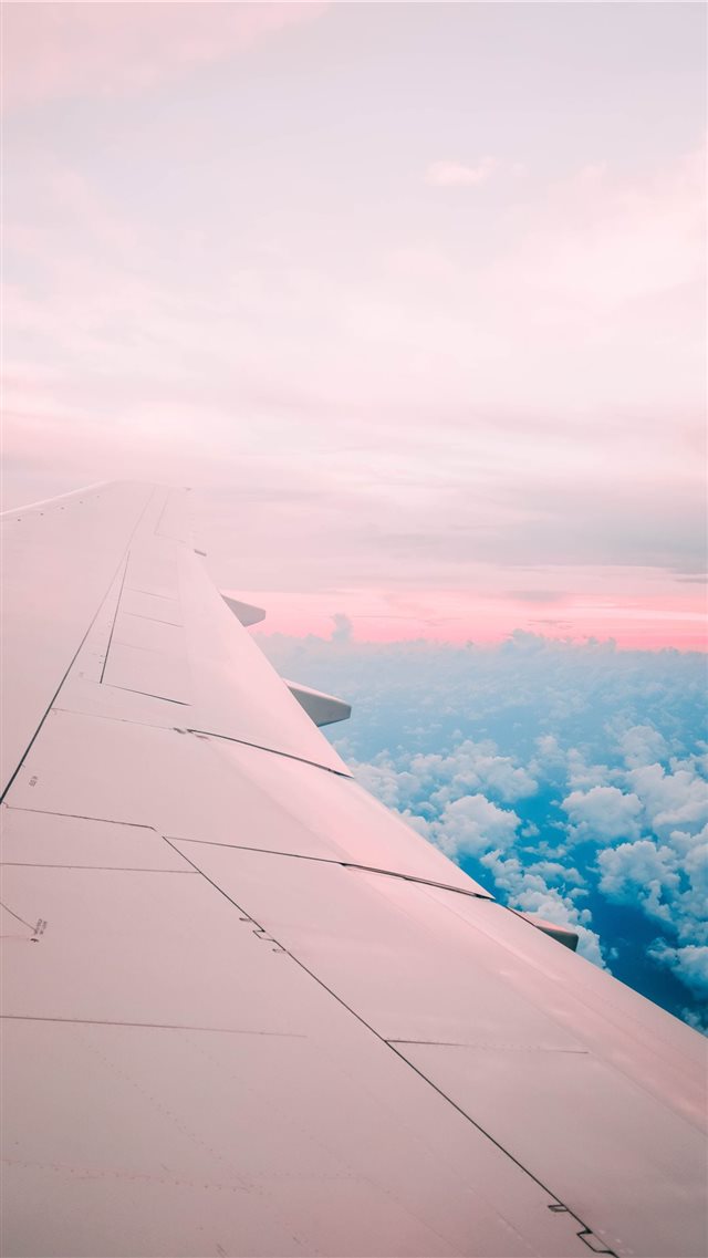 airline under white sky iPhone 8 wallpaper 