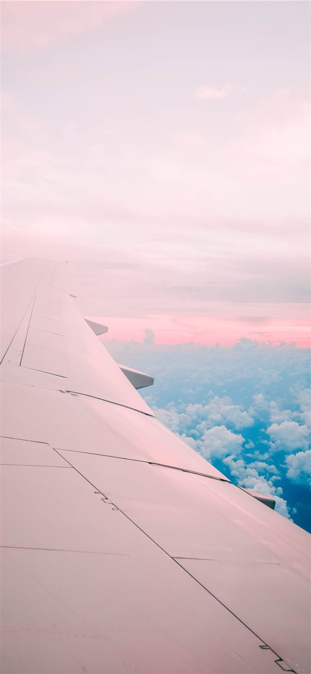 airline under white sky iPhone X wallpaper 