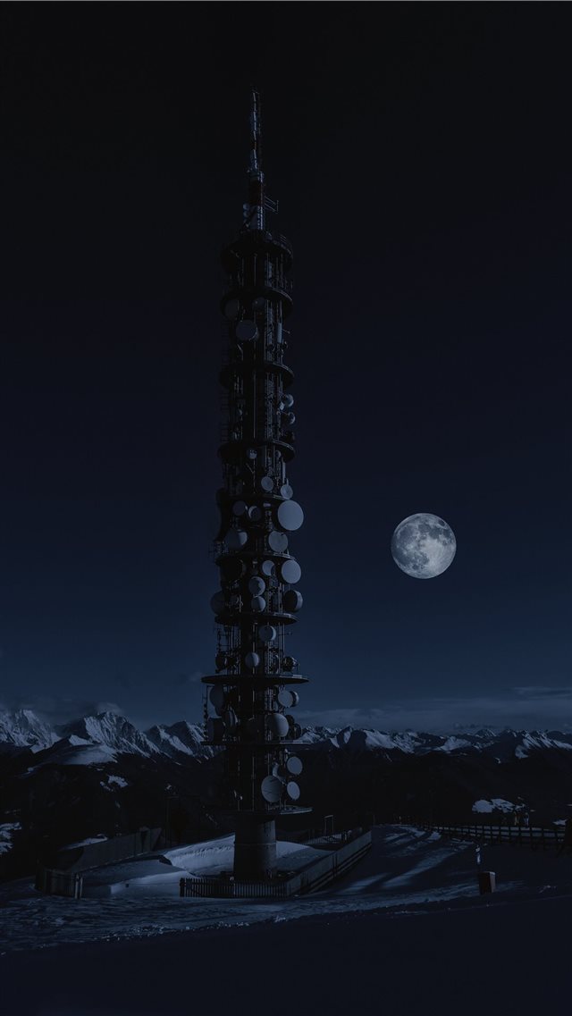 tower on snow under full moon iPhone 8 wallpaper 
