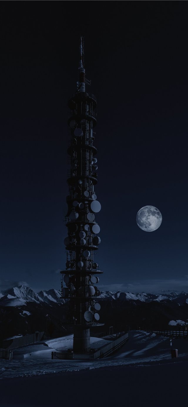 tower on snow under full moon iPhone X wallpaper 
