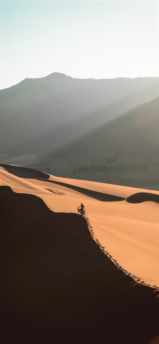 Hiking in the Great Sand Dunes National Park the m... iPhone X wallpaper 