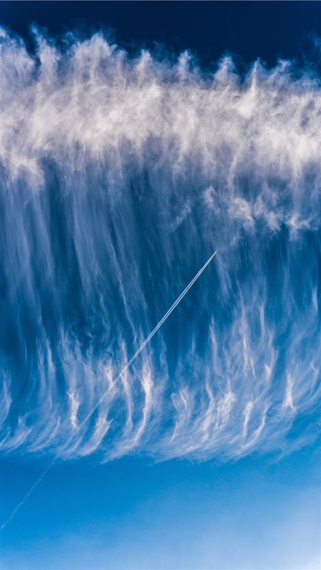 Sky surfing   Airplane skytrail (contrail) in a wa... iPhone 8 wallpaper 