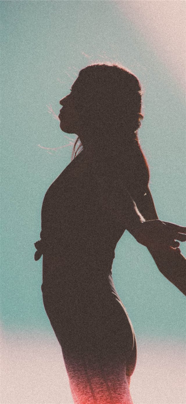 Woman against the sky iPhone X wallpaper 