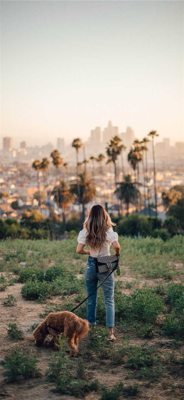 Carleigh  Odie and I out for a walk in East Los An... iPhone X wallpaper 