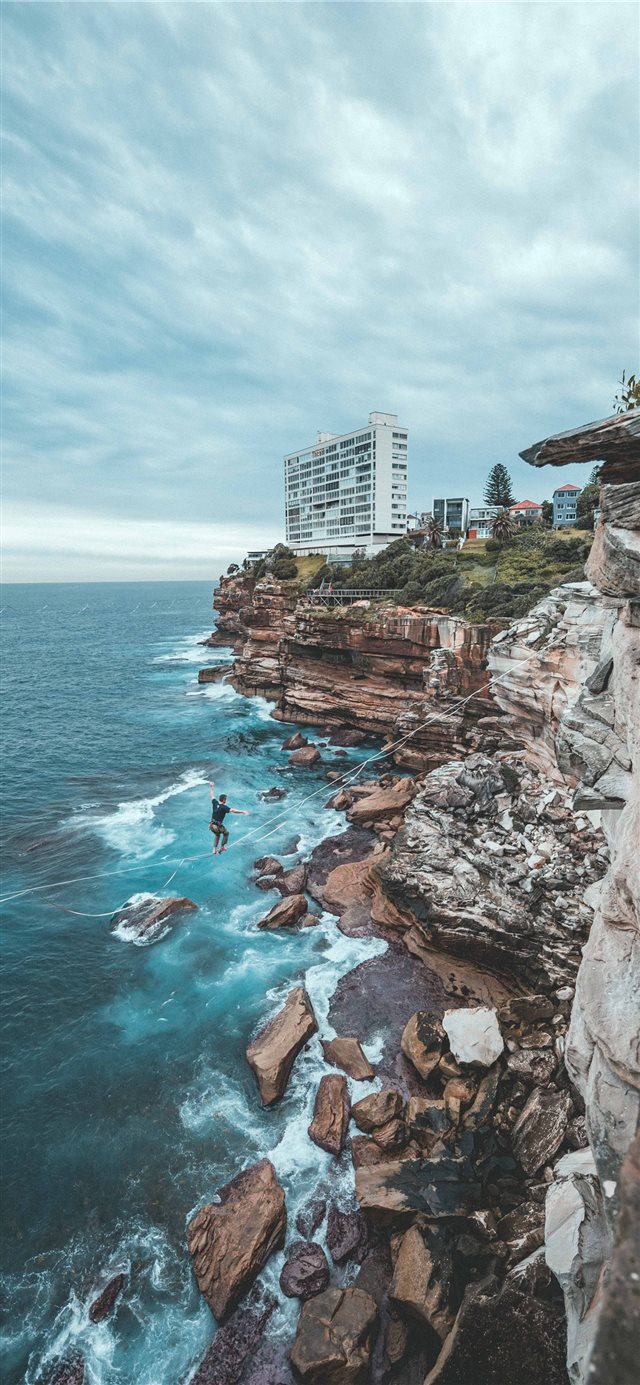 Sydney's coastal cliffs are a great spot to Highli... iPhone X wallpaper 