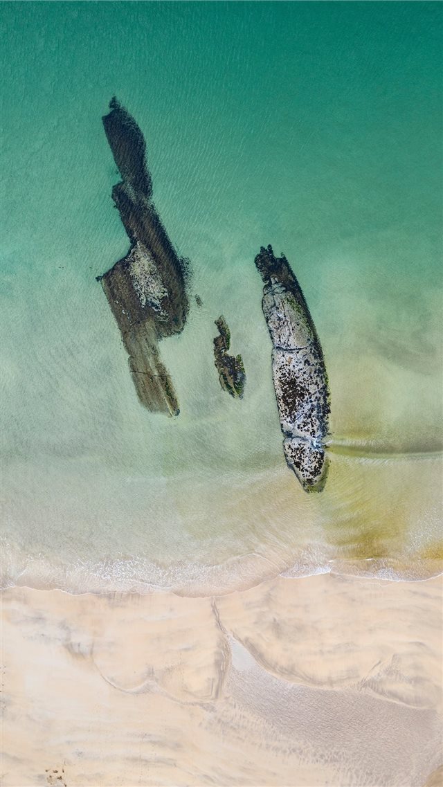Nature's Shipwreck  Aerial photo of Kiloran Bay on... iPhone 8 wallpaper 