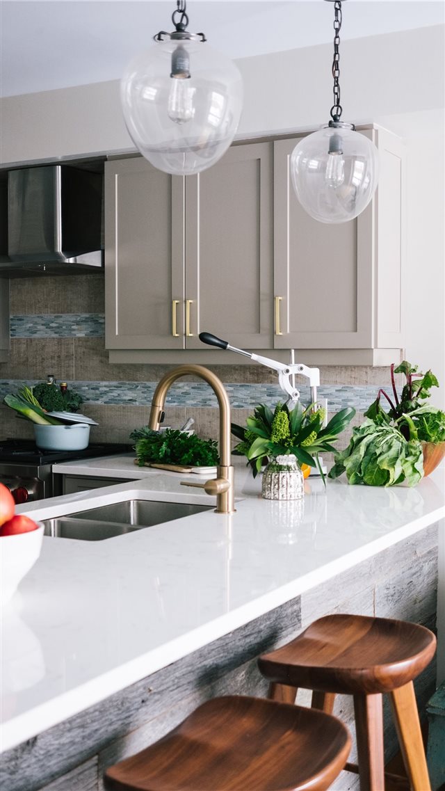 Nicely designed white kitchen with lots of greener... iPhone 8 wallpaper 