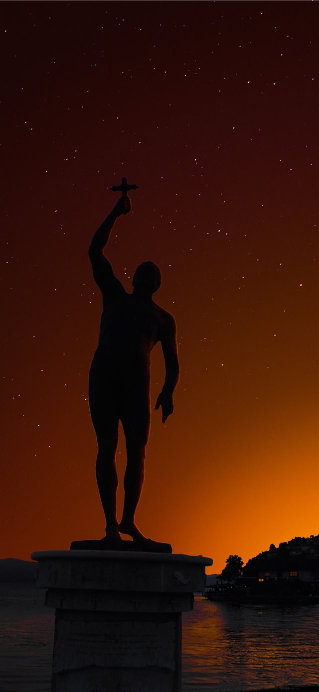 The monument “Catcher of the Cross” represents t... iPhone X wallpaper 