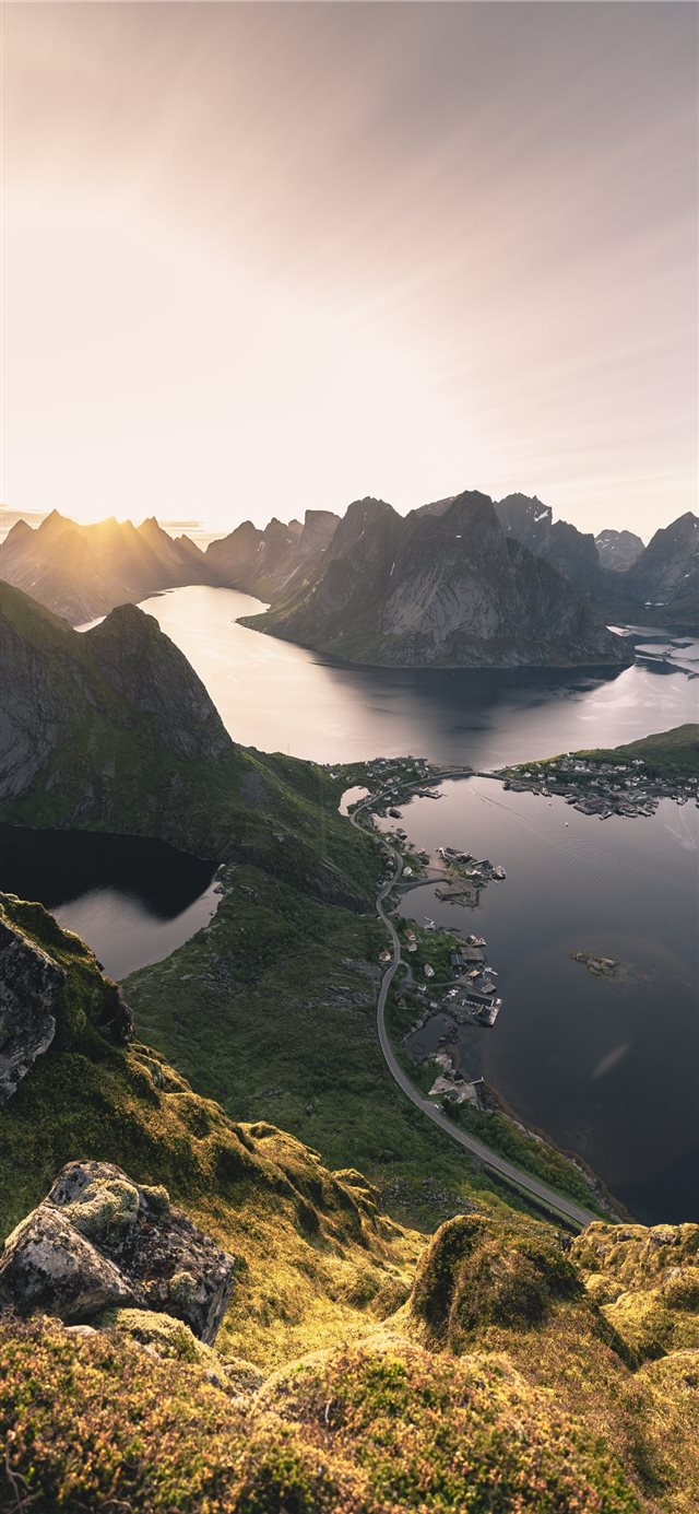 aerial photo of mountains surrounded with body of ... iPhone 11 wallpaper 