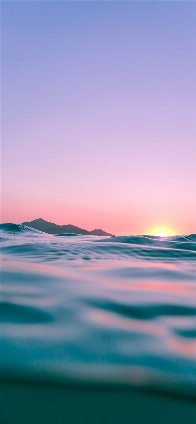 calm body of water during golden hour iPhone X wallpaper 