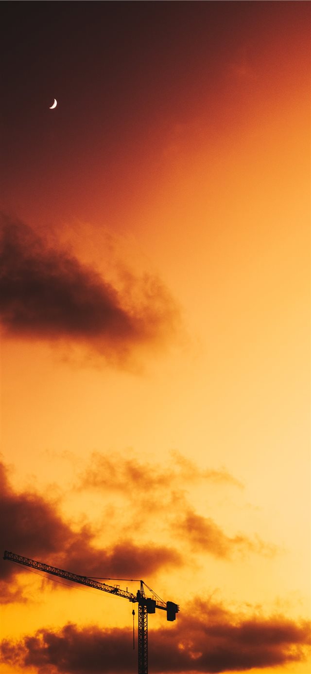 industrial crane during golden hour iPhone 11 wallpaper 