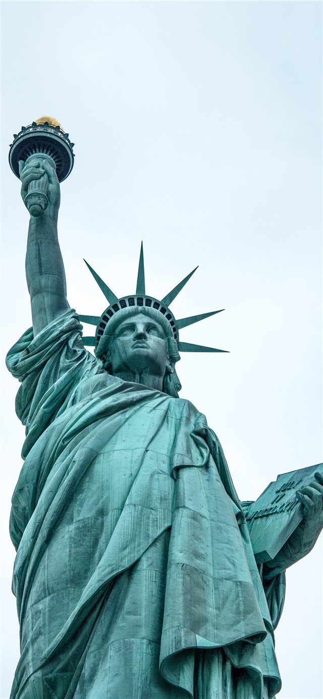 low angle photography of Statue of Liberty iPhone X wallpaper 