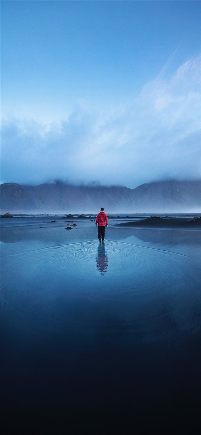 men standing on the ocean during faytime iPhone 11 wallpaper 