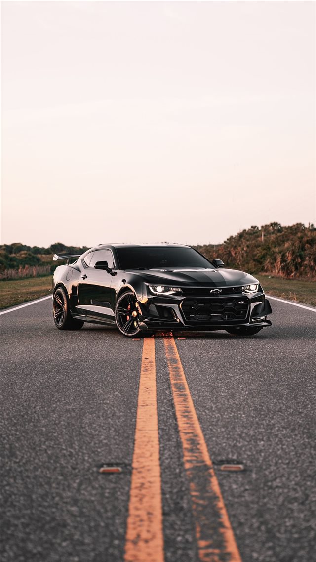 parked black coupe on road iPhone 8 wallpaper 
