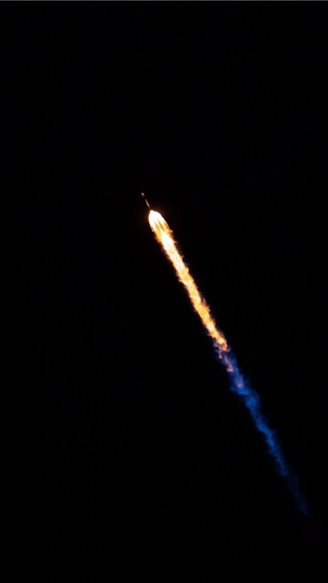 rocking flying in sky during night time iPhone 8 wallpaper 