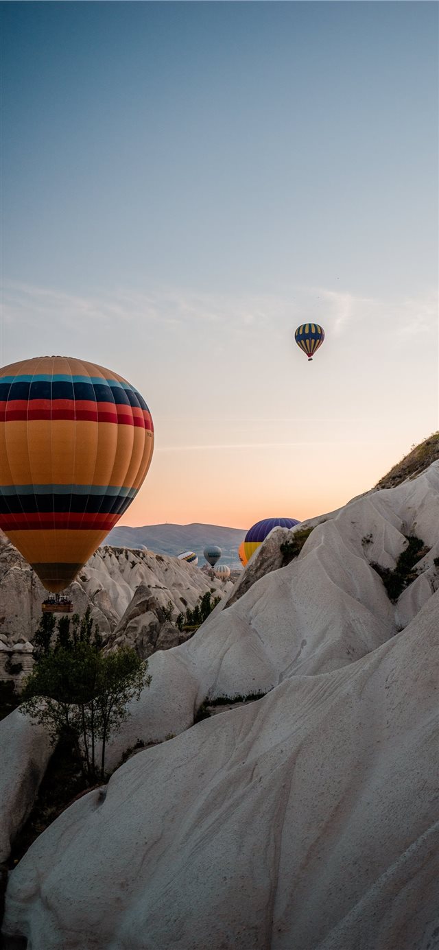 yellow and multicolored hot air balloon iPhone X wallpaper 