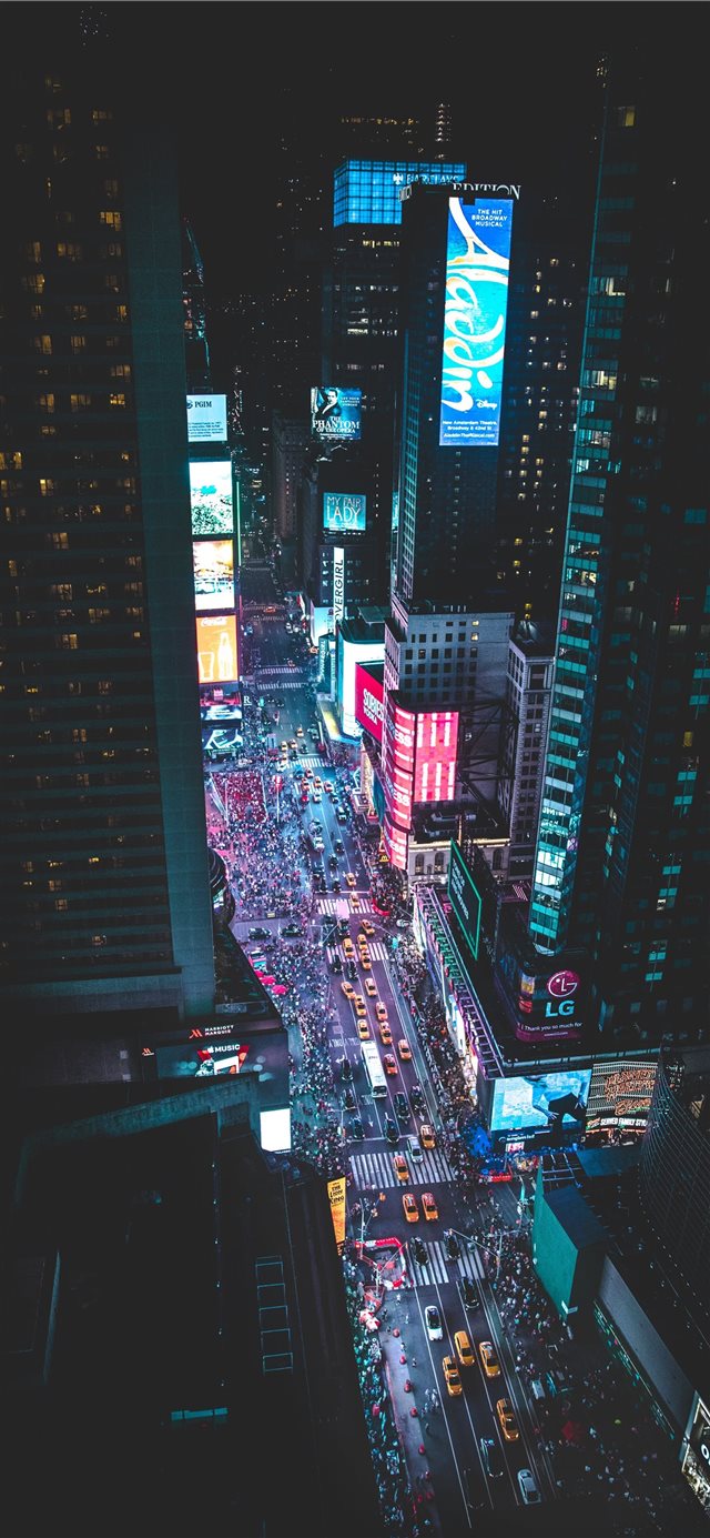 aerial photo of a busy city during night time iPhone 11 wallpaper 
