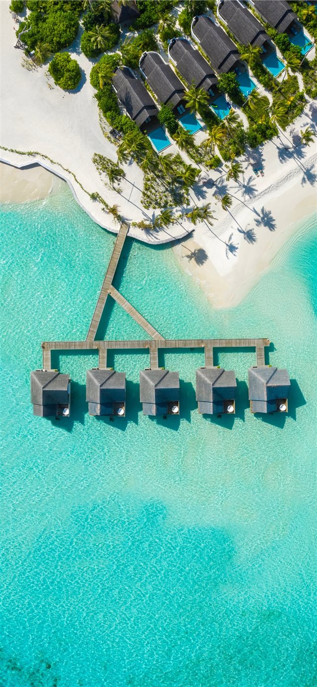 brown huts on body of water in aerial photography iPhone 11 wallpaper 