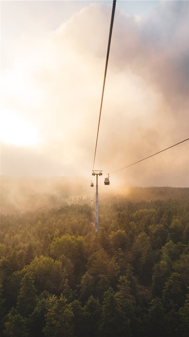 cable car under brown and white sky iPhone 8 wallpaper 