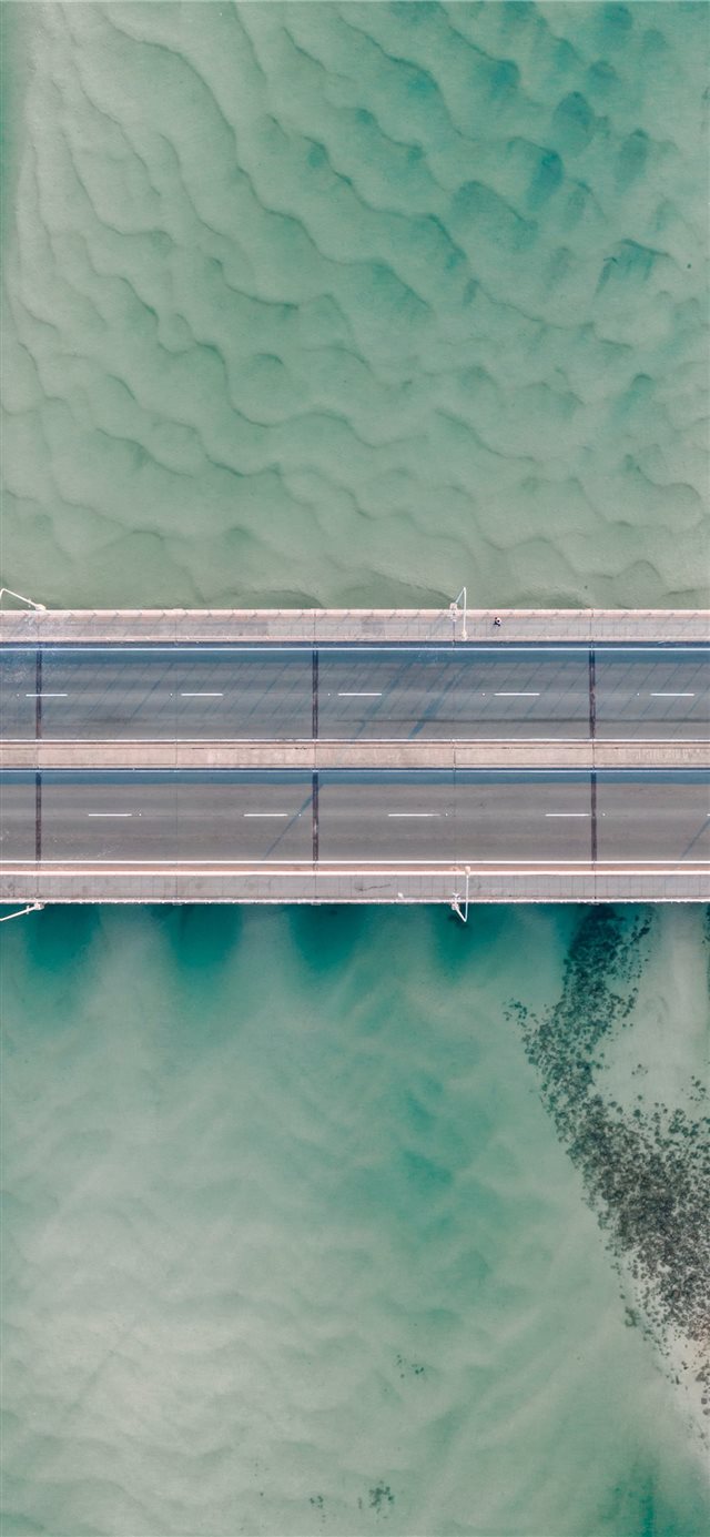 high angle photo of gray concrete road iPhone X wallpaper 