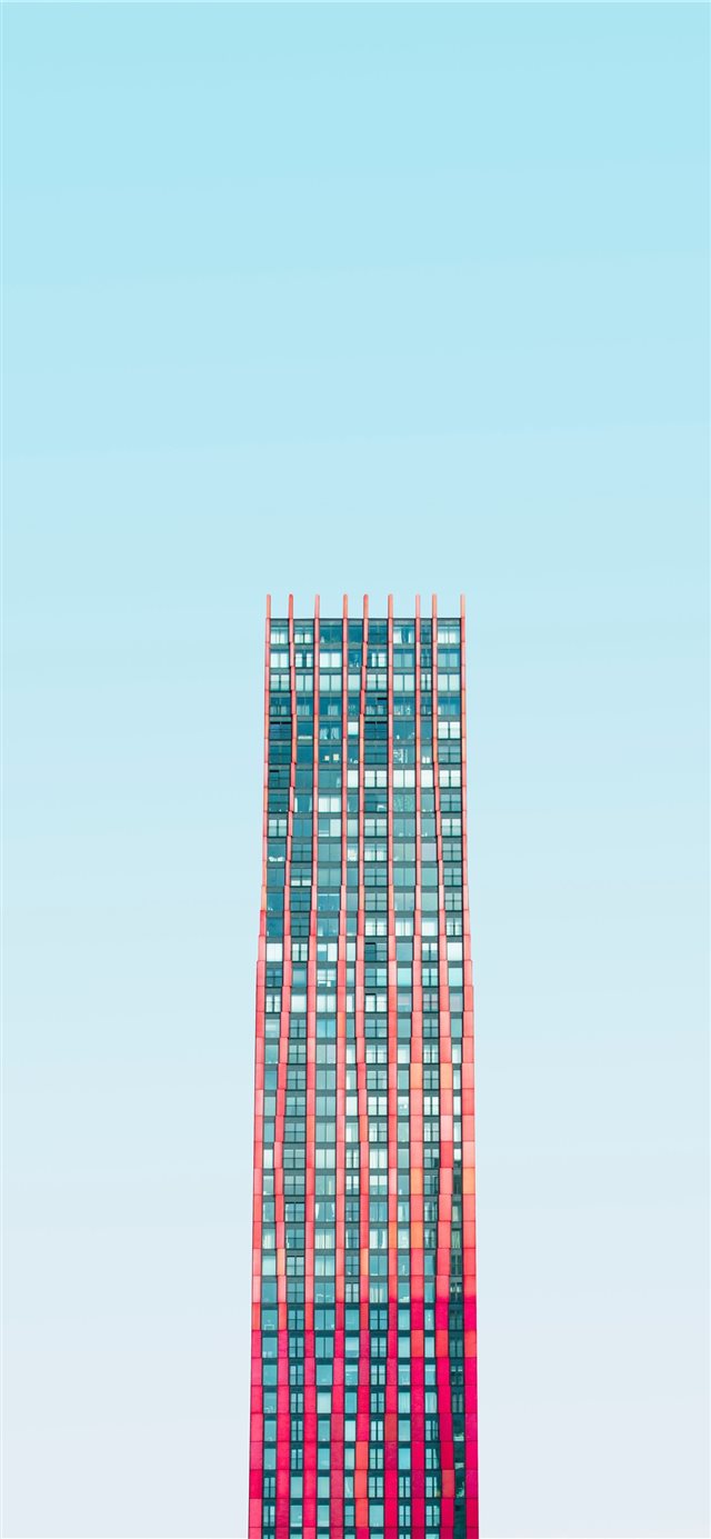 high rise building under blue skies daytime iPhone X wallpaper 
