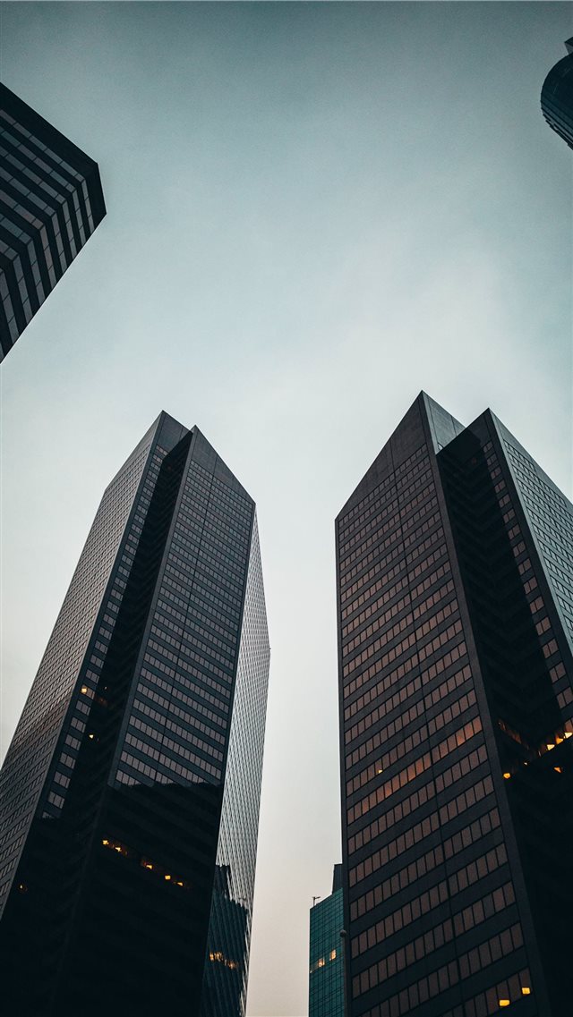low angle photo of high rise building during dayti... iPhone 8 wallpaper 