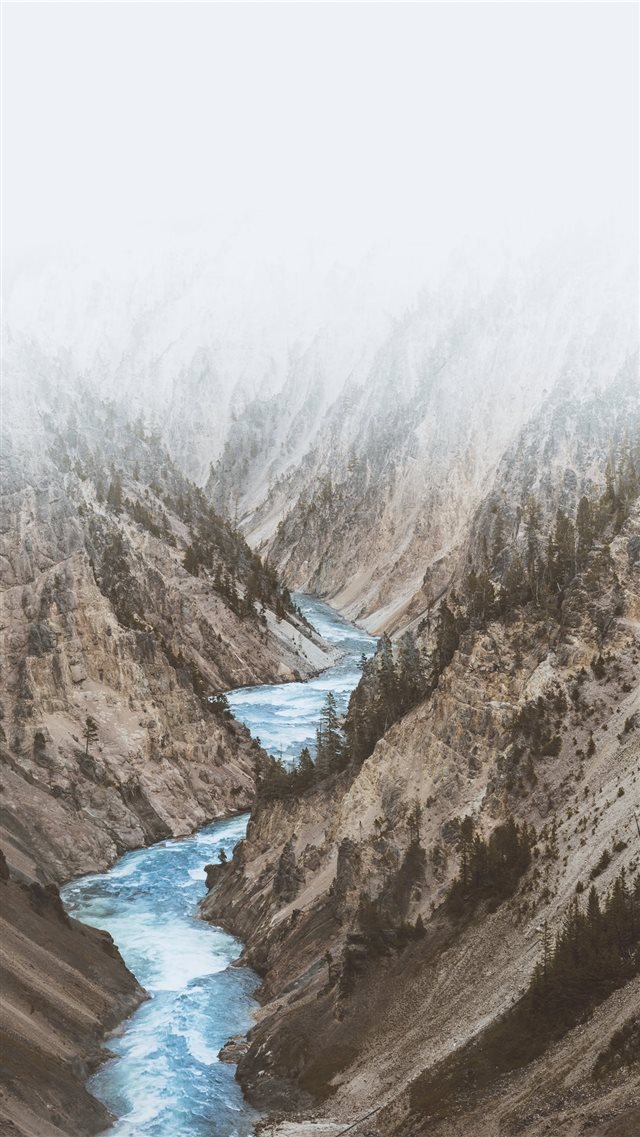 river between mountains under white clouds iPhone SE wallpaper 