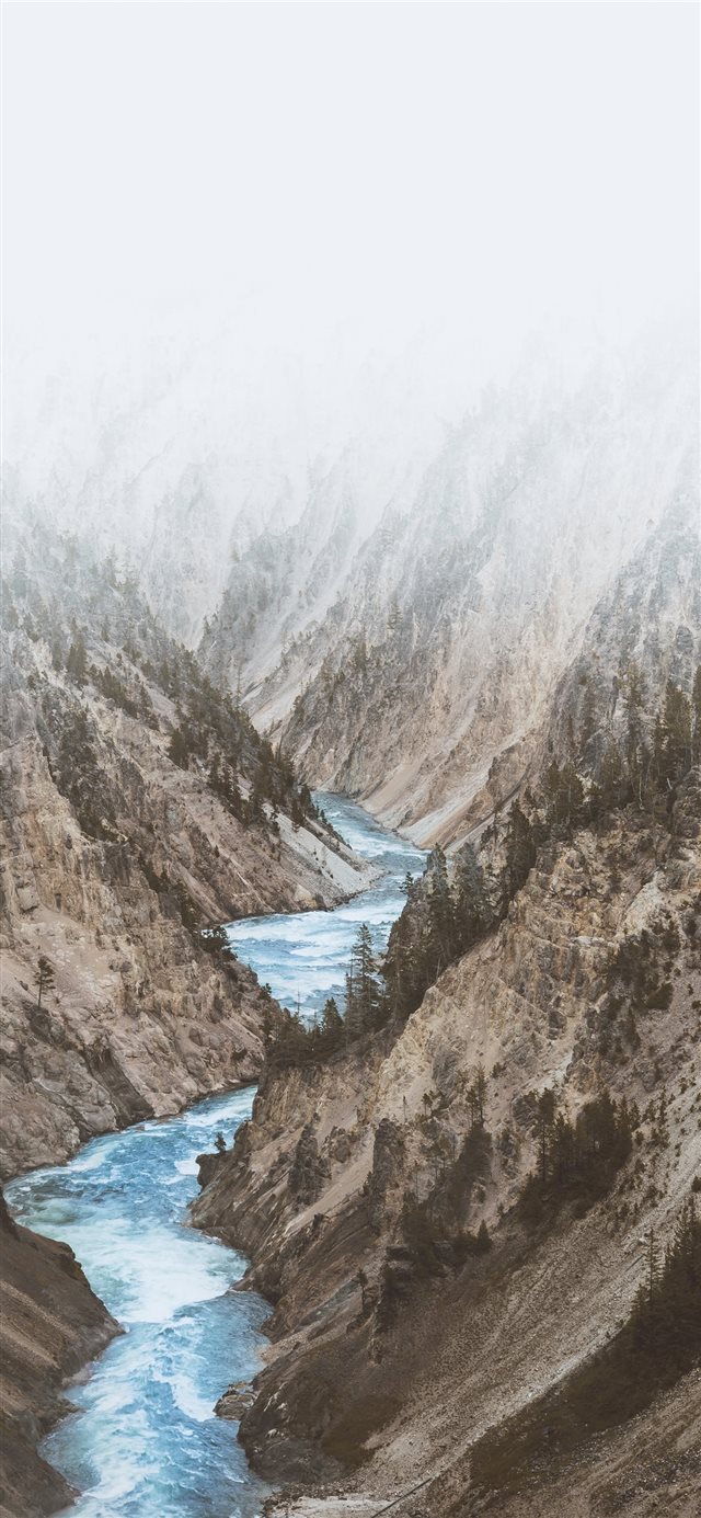river between mountains under white clouds iPhone X wallpaper 