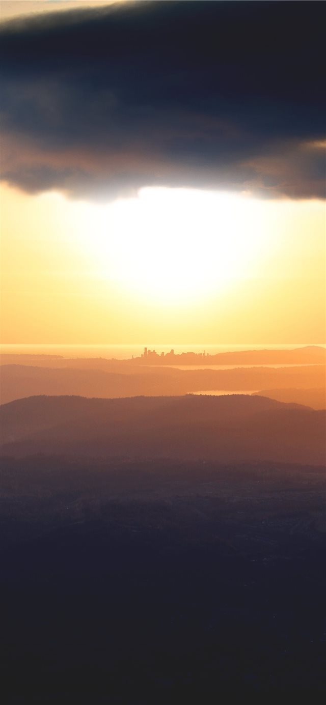 silhouette of mountain during golden hour iPhone 11 wallpaper 