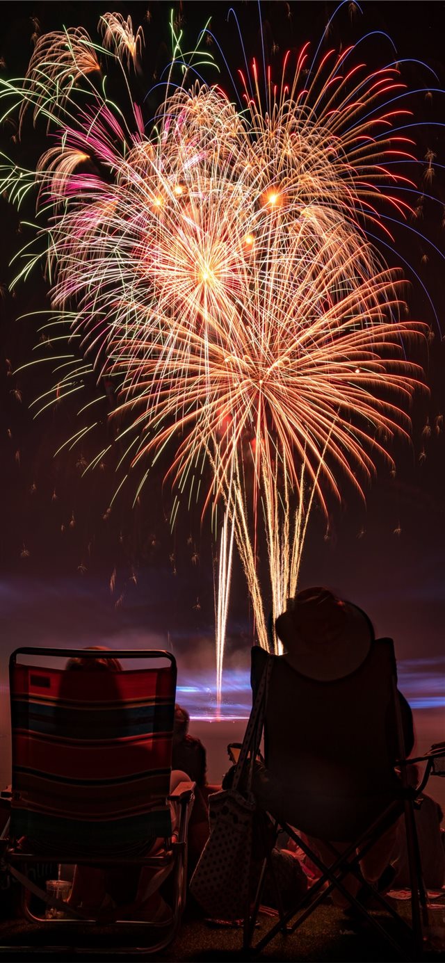 two people watching fireworks display iPhone X wallpaper 