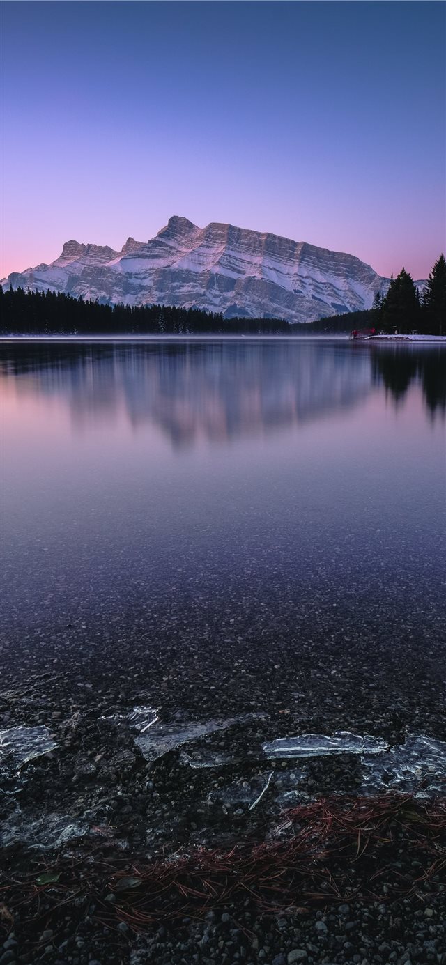 mountain near body of water iPhone X wallpaper 