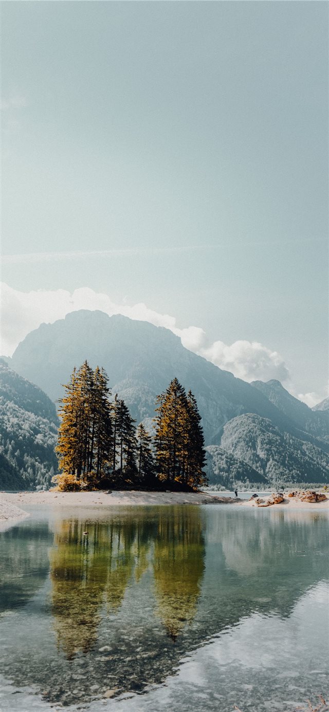 body of water near mountain painting iPhone X wallpaper 