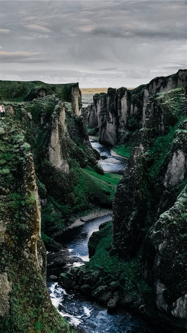 river surrounded by rock formation iPhone 8 wallpaper 