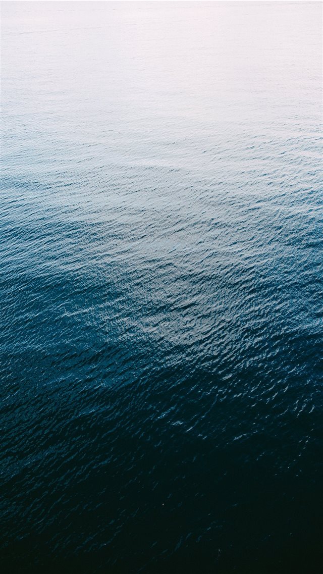 A shot of the Pacific Ocean from above iPhone 8 wallpaper 