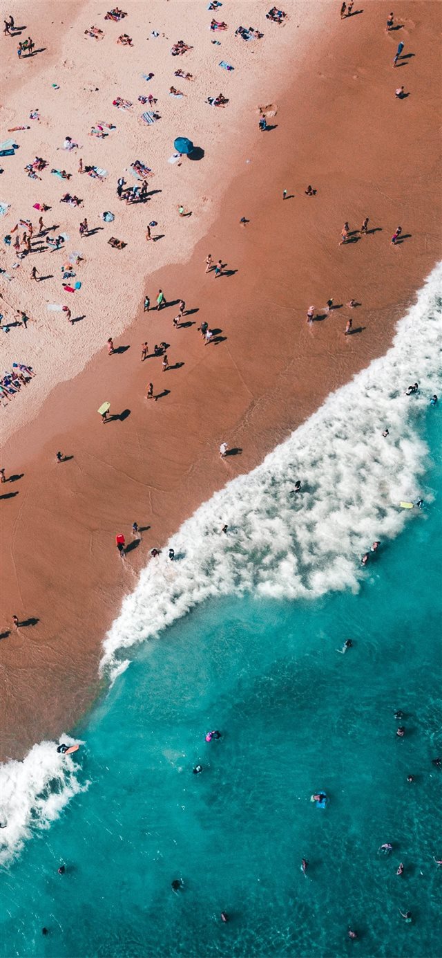 aerial photography of people on beach iPhone X wallpaper 