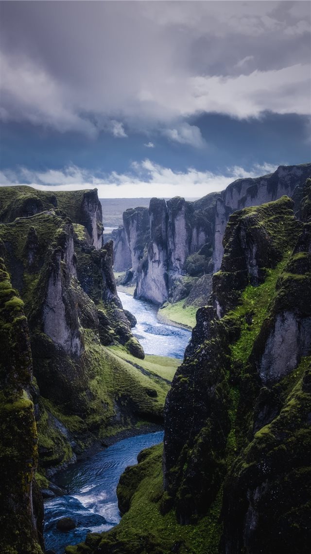 aerial photography of river between mountains duri... iPhone 8 wallpaper 