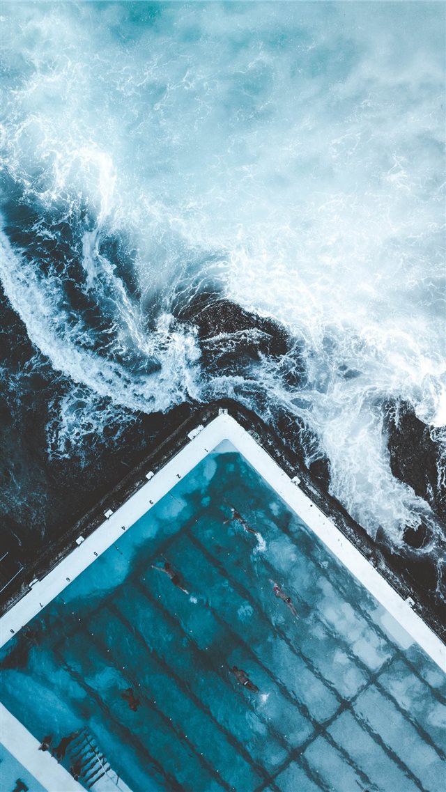 aerial view of ocean beside dock iPhone 8 wallpaper 