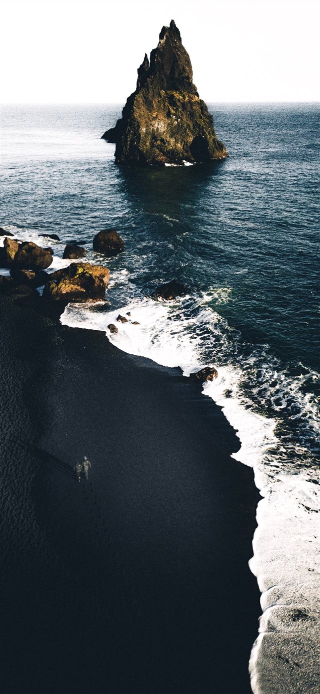brown cliffs on ocean iPhone X wallpaper 