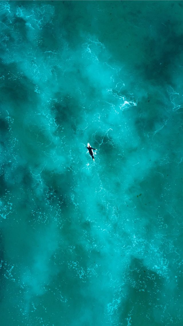man surfing during daytime iPhone 8 wallpaper 